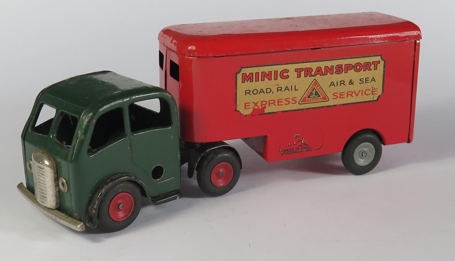 A Triang Minic Clockwork 3M Mechanical Horse and Pantechnicon Trailer in dark green and red. Motor