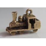 A 9ct Gold Charm in the form of a steam train, 2.6g, 16mm long