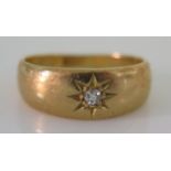 A Child's 18ct Gold and Diamond Gypsy Ring, size E, 2.8g