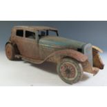 A Large Scale Mettoy Clockwork Tinplate Car in blue and cream in poor condition and motor does not
