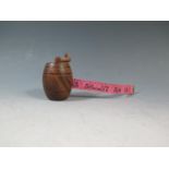 A Carved Treen Barrel Tape Measure, 7cm tall