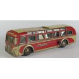 A Tinplate Clockwork Tippco Coach in Red and grey/cream made in Germany (24cm approx). Motor works.