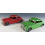 Two Metty Clockwork Streamline Cars in Green and Red.