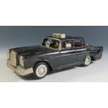 A Scarce Ichiko Tinplate Mercedes Benz Taxi Cab in Black Made in Japan (19cm approx).