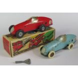 A Triang Minic No. 1 Racing Car in red with blue base in original box and key and one other in light