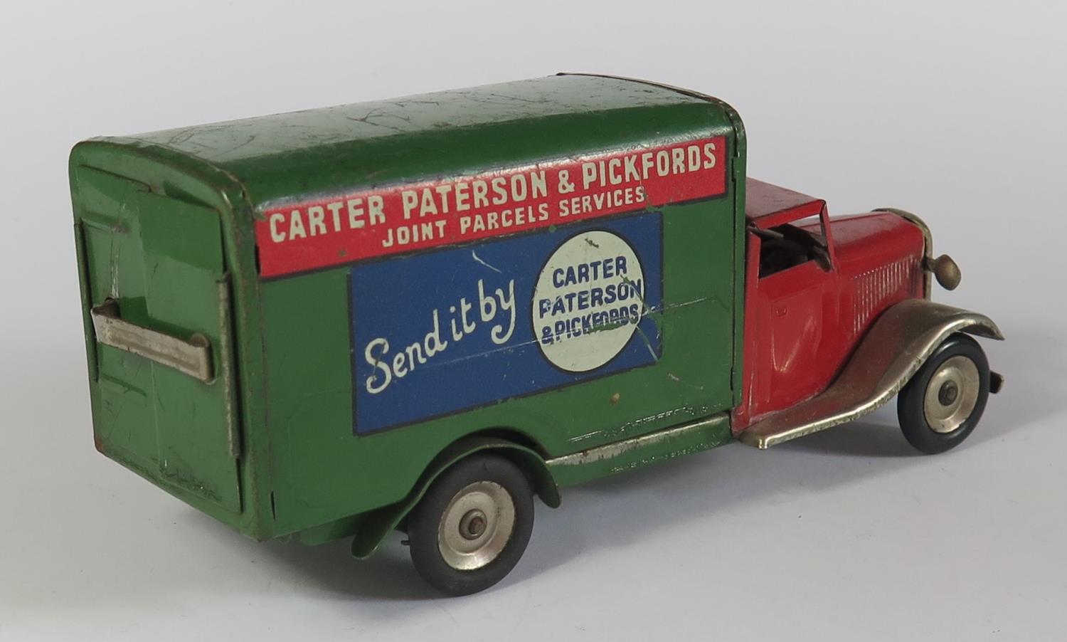 A Triang Minic Clockwork 22M Delivery Van in red and green with decals "Carter Peterson & - Image 2 of 3