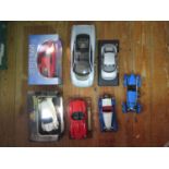 A Collection of Burago and Maisto Scale Model Cars. Some damaged.