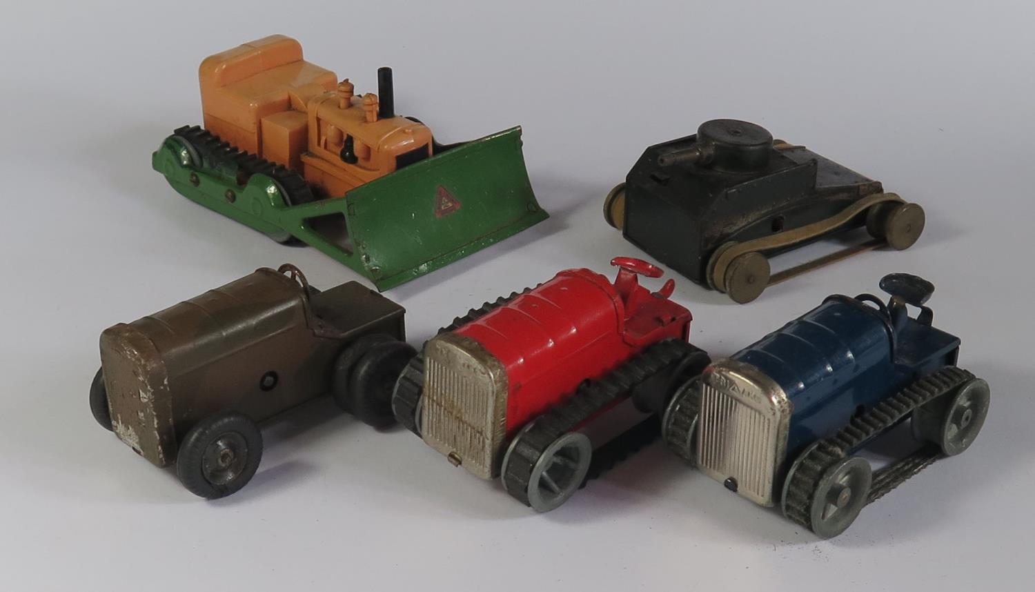 Five Triang Minic Clockwork Toys. Three 11M Tractor Variations, an Allis Chalmers Bulldozer and a