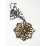 A Silver Set Citrine Flower Head Pendant on chain, pendant 44mm diam., necklace 48cm long, 14.9g