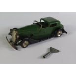 A Triang Minic 18M Vauxhall Town Coupe Car in green and black with red base. Working motor with key