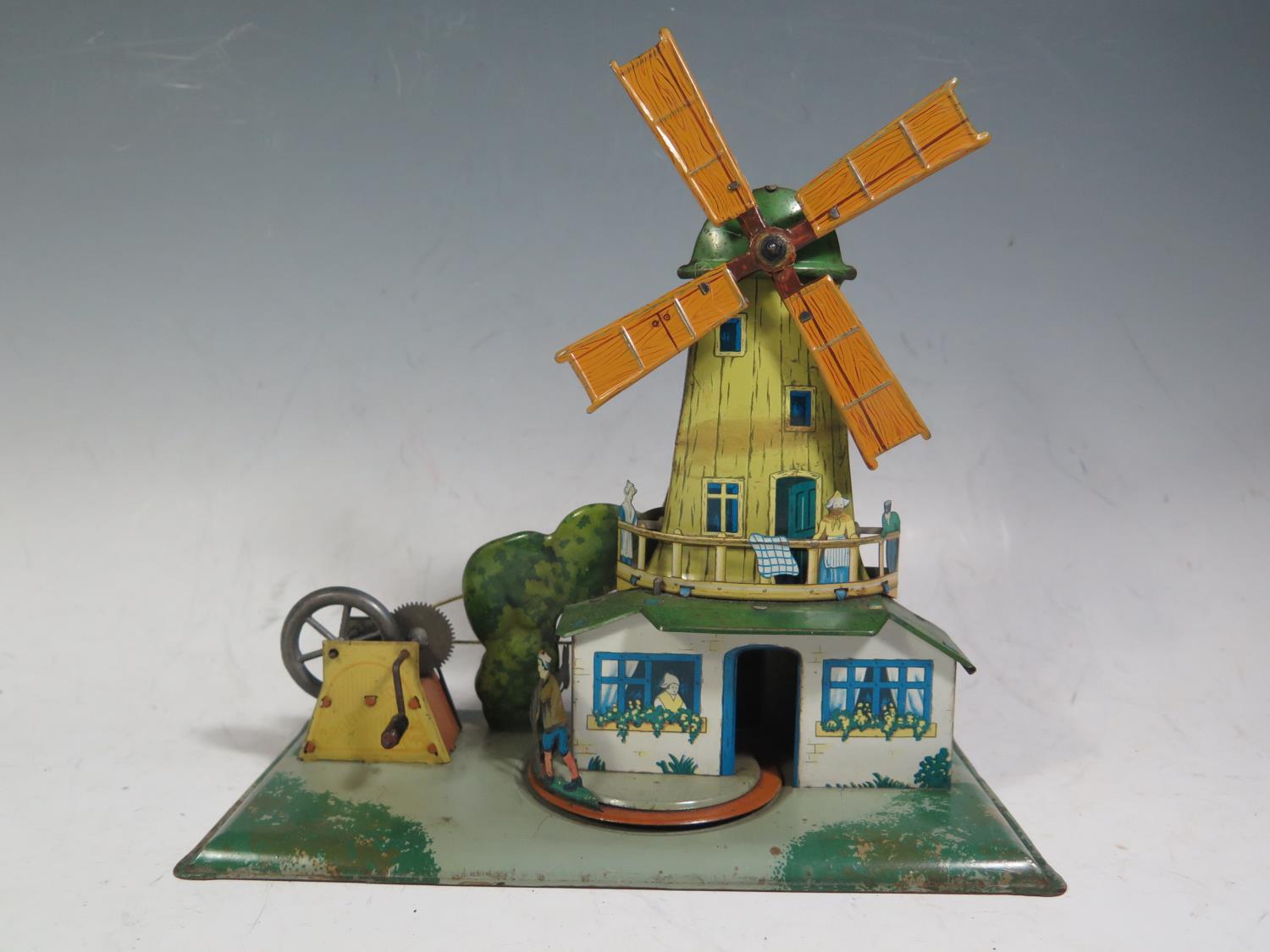 A Scarce Centrimotor (German) Mechanical Tinplate Windmill with Rotating Donkey and Man.