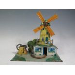 A Scarce Centrimotor (German) Mechanical Tinplate Windmill with Rotating Donkey and Man.