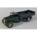 A Triang Minic Clockwork Delivery Lorry with tipping bed in dark green and dark blue. Motor works.