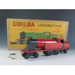A Chad Valley Ubuilda Clockwork Train in Red "LMS" in it's Original Box (25.5cm approx) motor works.