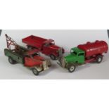 Two Triang Minic Clockwork Delivery Lorry and Petrol Tanker both with repainted cabs and a breakdown