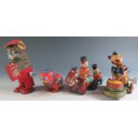 Four Clockwork Tinplate Toys Including a Drumming Pander, Accordion playing bear, Robot and