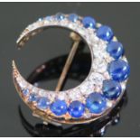 A Victorian Cabochon Sapphire and Old Cut Diamond Crescent Brooch, 5.2g, 27mm diam., probably Ceylon