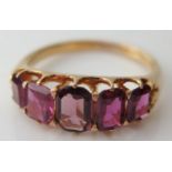 A Pink Ruby Five Stone Ring in an unmarked high carat gold setting, size P, 6.2g, largest stone