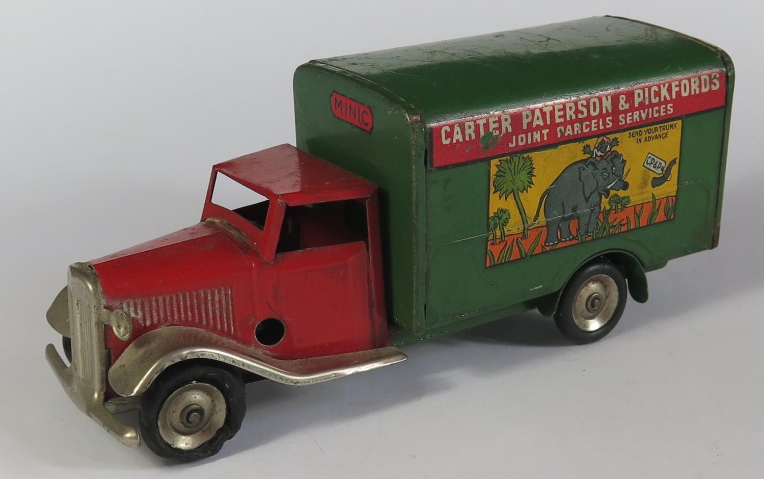 A Triang Minic Clockwork 22M Delivery Van in red and green with decals "Carter Peterson &