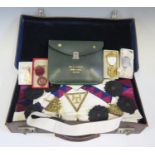 A Case of Masonic Regalia including apron, sash, 'jewels' etc.