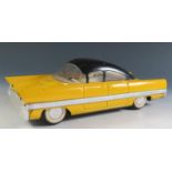 A Tinplate Car, possibly Gaz Volga and Russian made? Yellow and black (27.5cm approx).