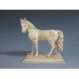 An Antique Carved Ivory Model of a Horse, 10cm high