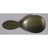 A Liberty TUDRIC Pewter Caddy Spoon decorated with holly and berries, model 01244, 10cm long