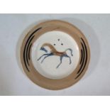 A Clarice Cliff 'Chevaux' or 'Chaldean' Plate, designed by John Armstrong and produced by Clarice