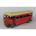 Triang Minic "Push 'n Go" Single Deck Bus in red/cream.