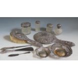 Two Pierced Silver Dishes, silver top dressing table pots, silver backed hand mirror and brush etc.,
