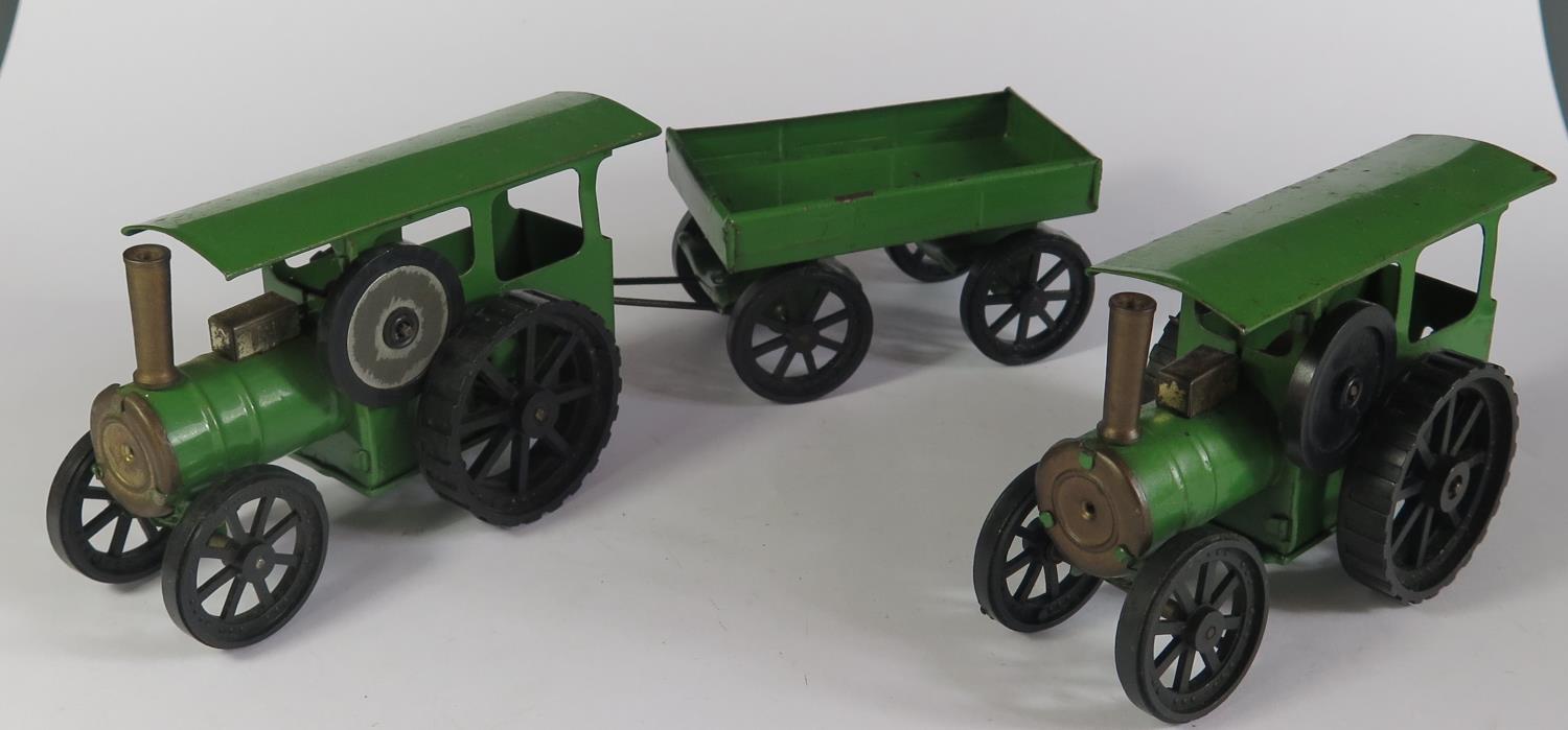 Two Triang Minic Clockwork Traction Engines (one motor needs attention) and one trailer.