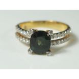 A Green Sapphire and Diamond Ring in an unmarked gold setting, size M, 3.4g