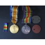 A WWI Medal Pair awarded to 45421 PTE. E.E. BRIMICOMBE. D.C.L.I. and dog tags
