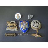 A Selection of Military Badges including Leicestershire, Northamptonshire and Royal Corps of