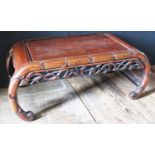 A Chinese Rosewood Coffee Table with naturalistic carved bamboo edges and carved and pierced