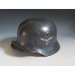 A WWII German Luftwaffe Single Decal Helmet, stamped T1245 and 064? (rubbed)