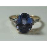 A 14K Yellow Gold, Tanzanite and Diamond Ring, size N, 3.3g, central stone 11x9mm