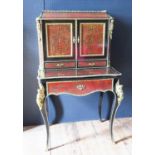 A 19th Century French Boulle Bonheur du Jour with cabriole legs mounted with gilt angels to the