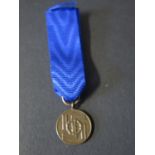 A WWII German 8 Year Service Miniature Medal