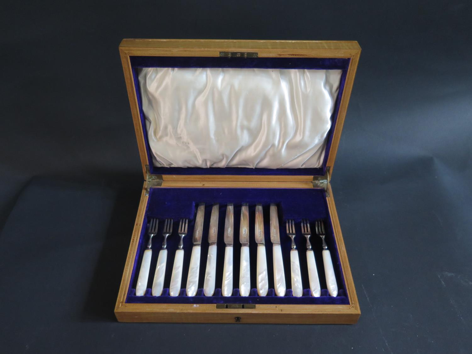 A George V Satinwood and Inlaid Canteen of Silver Fruit Knives and Forks with mother of pearl