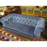 A Three Seater Chesterfield in blue dralon upholstery