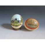 An Ostrich Egg Painted with a Clipper entitled OUTWARD BOUND and one other decorated with ostriches