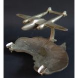 A 1947 Australian Ashtray in the form of the sub-continent with an aeroplane flying over, 15.5cm