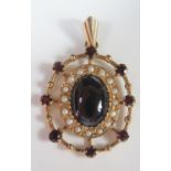 A 9ct Gold, Garnet and Pearl Brooch with central cabochon stone, 39mm drop, 5.2g