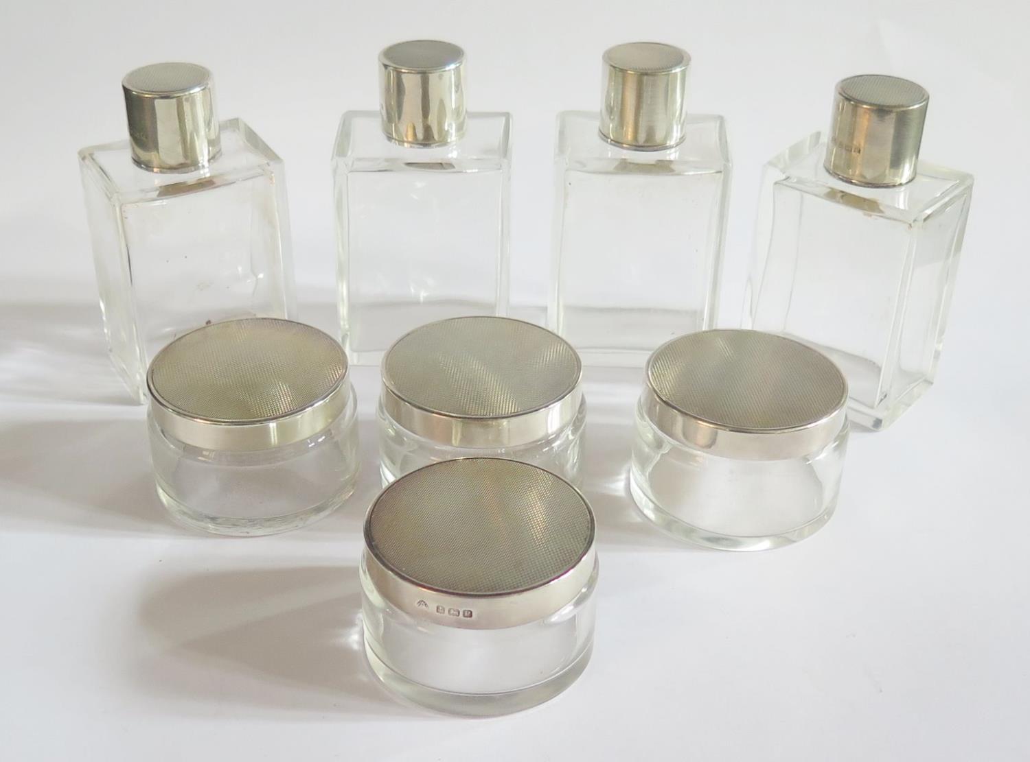 A Set of Eight George V Art Deco Silver Top Bottles with engine turned decoration, Birmingham