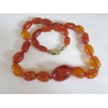 An Amber Bead Necklace, 73cm, largest bead 40x29mm, 112g