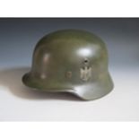 A German WWII Army DD Helmet, rim stamped Q66 & DN311, leather stamped 58, no chin strap,