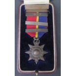 A Cased Royal Marine Twenty Service Medal with 1926, 1927, 1930 and 1931 Bars