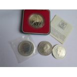 A Mint 1999 £2 One Ounce Silver Britannia, 1977 Silver 'Silver Jubilee' Crown and two 1951 crowns