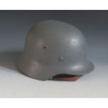 A WWII German Luftwaffe Helmet, printed in ink 854, impressed 4451 ET62 and leather insert 54